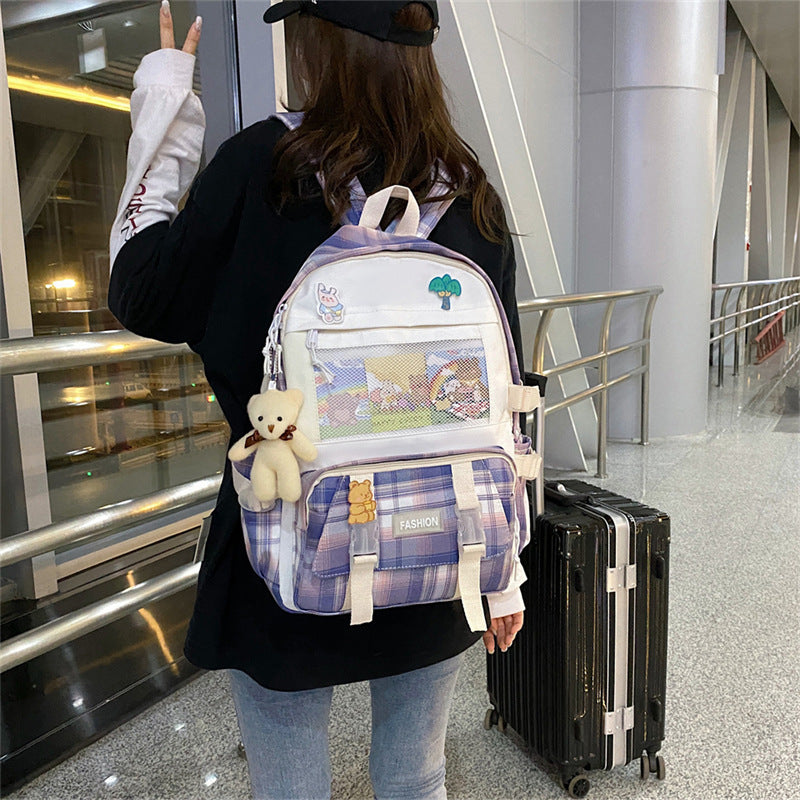Eprolo Kareli Japon tarzı sırt çantası with geometric black and white pattern, featuring adjustable shoulder straps and a front pocket.