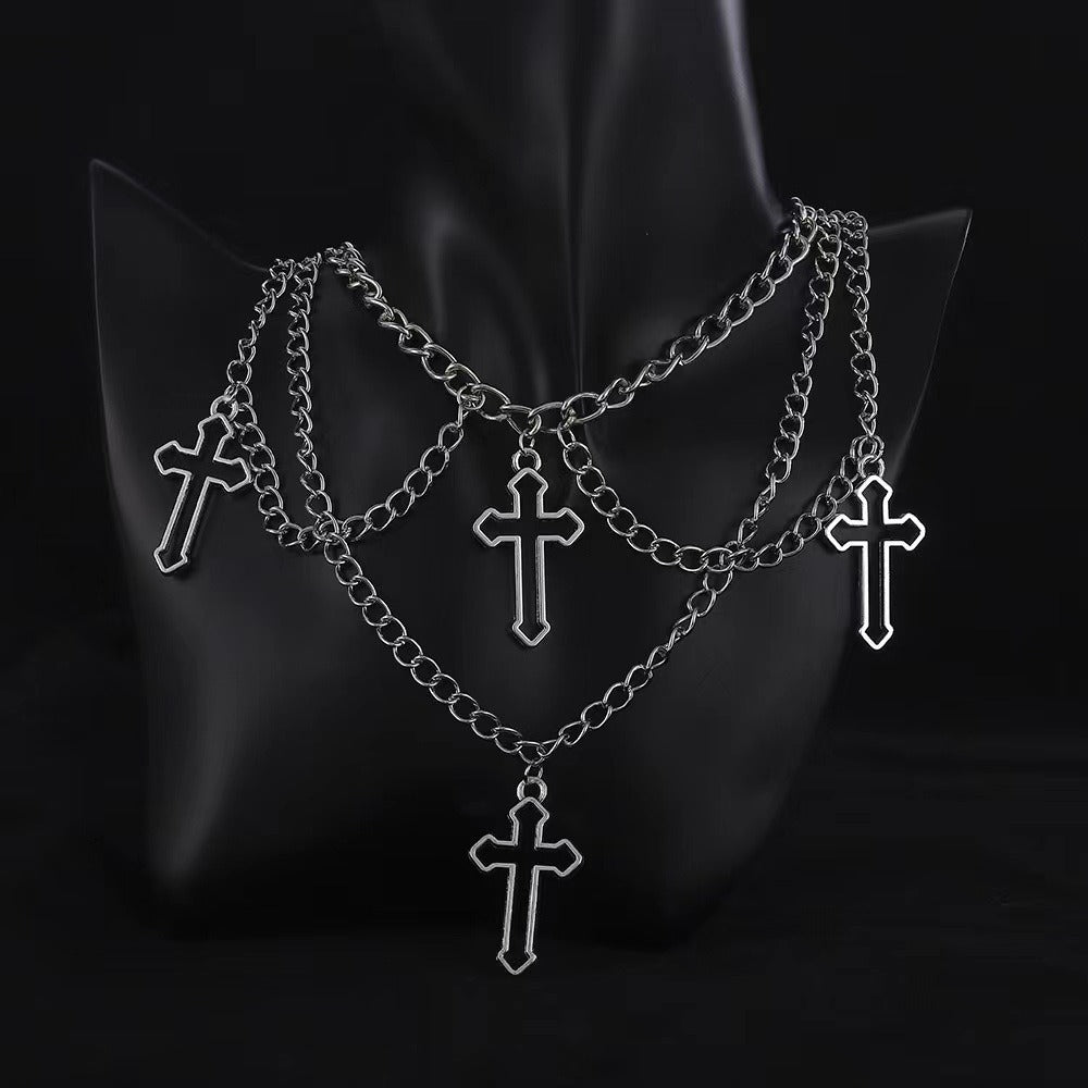Multi-layered cross necklace by eprolo featuring layered metal chains and a prominent cross pendant.