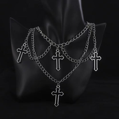 Multi-layered cross necklace by eprolo featuring layered metal chains and a prominent cross pendant.