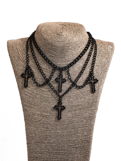 Multilayered cross necklace by eprolo featuring multiple gold-tone chains and a prominent cross pendant.