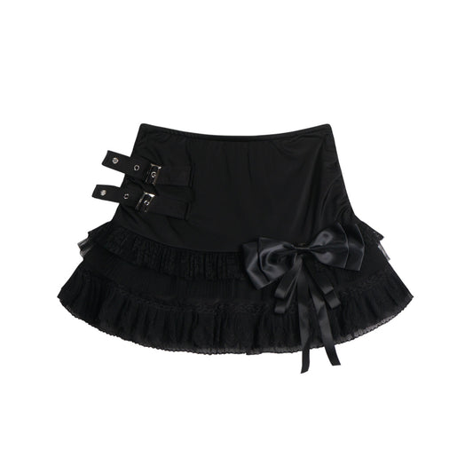 Eprolo low-rise bow mini skirt in black fabric, stylish and fitted, shown on a model.
