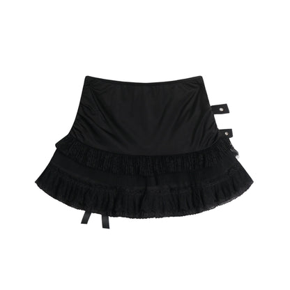Eprolo low-rise bow mini skirt in black, shown on a hanger with a smooth fabric and bow detail at the waist.