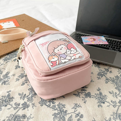 Eprolo Kore tarzı karikatürlü küçük omuz çantası with colorful cartoon design and adjustable strap over a plain background.