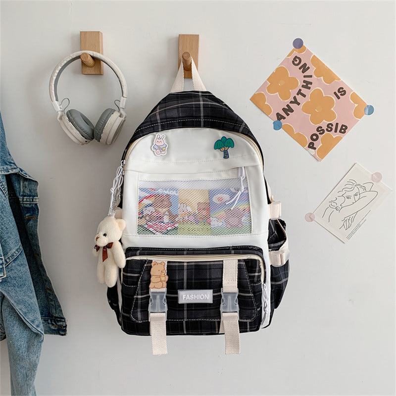 Eprolo Kareli Japon tarzı sırt çantası with black and white geometric pattern, front zipper pocket, and adjustable straps.