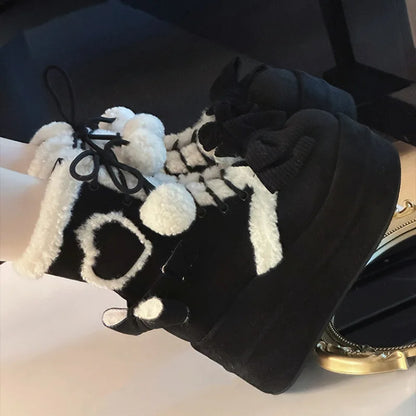 Fiyonk detaylı platform Şirin bot by eprolo, showcasing a stylish black shoe with decorative bow and chunky sole.