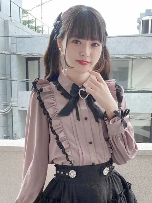 Pink bow lace ruffle blouse by eprolo featuring delicate lace and frills, displayed on a neutral background.