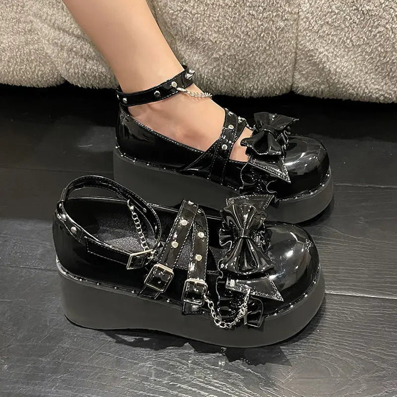 Eprolo Gothic Lolita platform Mary Jane shoes with black patent finish and chunky heel, detailed with decorative straps and buckles.