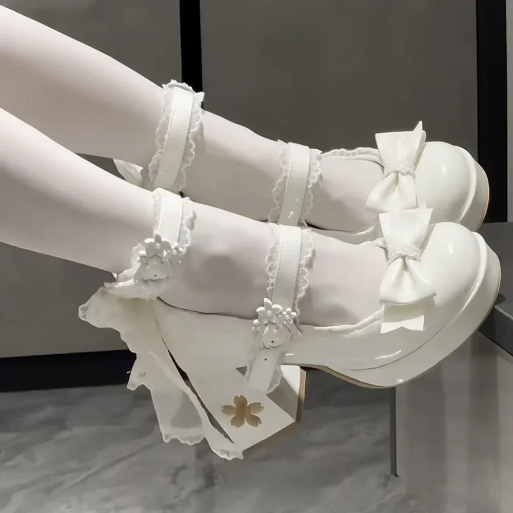 Eprolo Lolita pink platform high heels with ribbon details and pointed toe, stylish and cute for fashionable occasions.