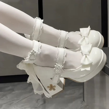 Eprolo Lolita pink platform high heels with ribbon details and pointed toe, stylish and cute for fashionable occasions.