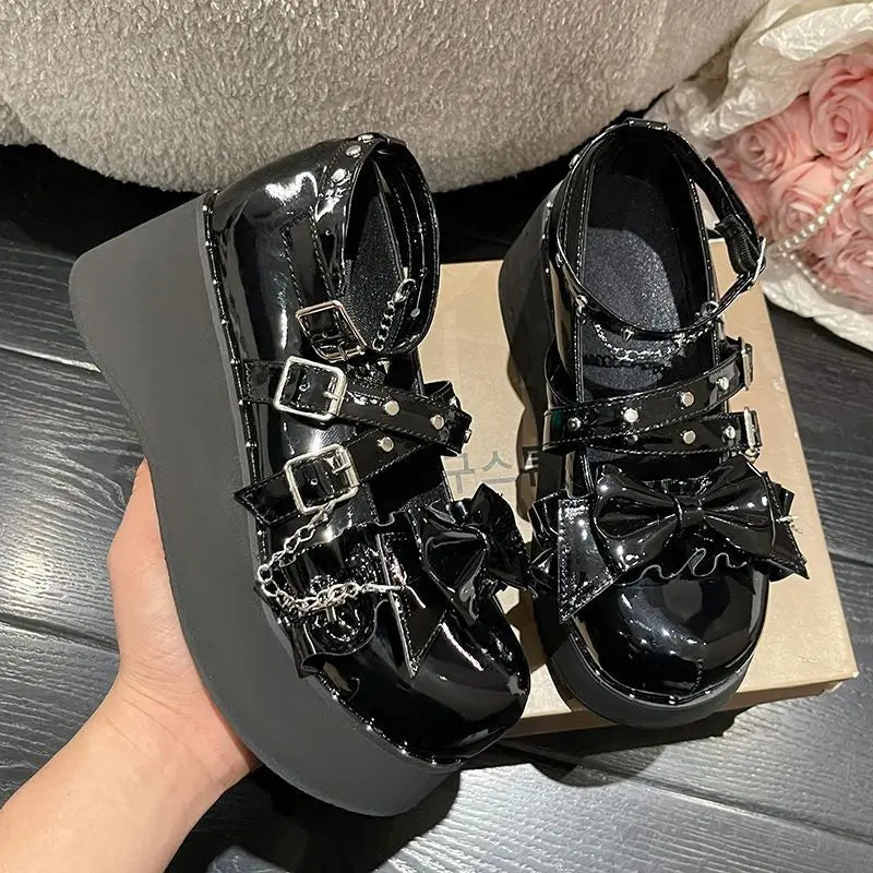 Eprolo Gothic Lolita platform Mary Jane shoes with ankle straps and chunky heels, featuring black glossy finish and decorative buckles.